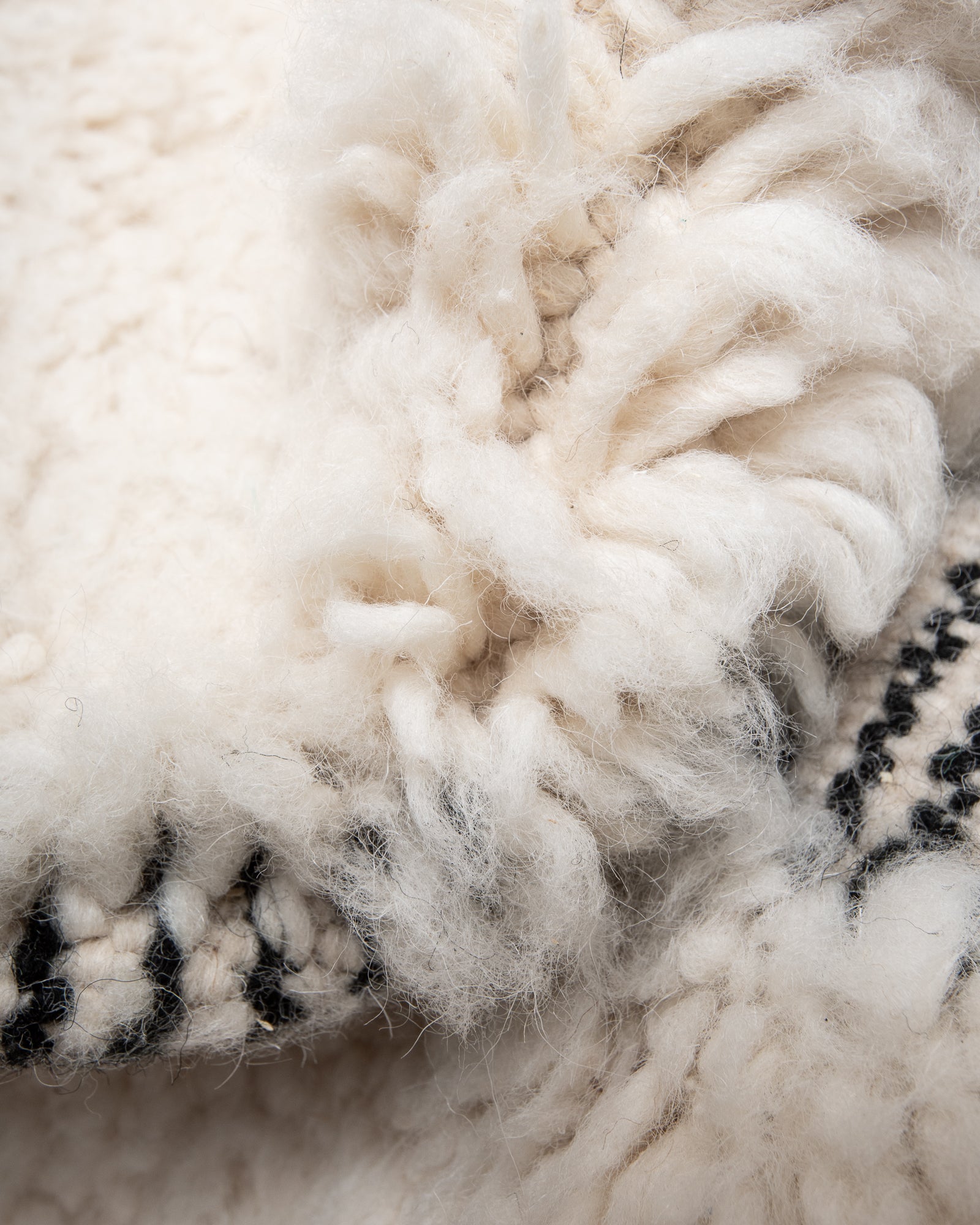 Modern, designer, handcrafted Berber rug from Morocco. Beniourain carpet with beautiful colours and patterns and fluffy wool texture.